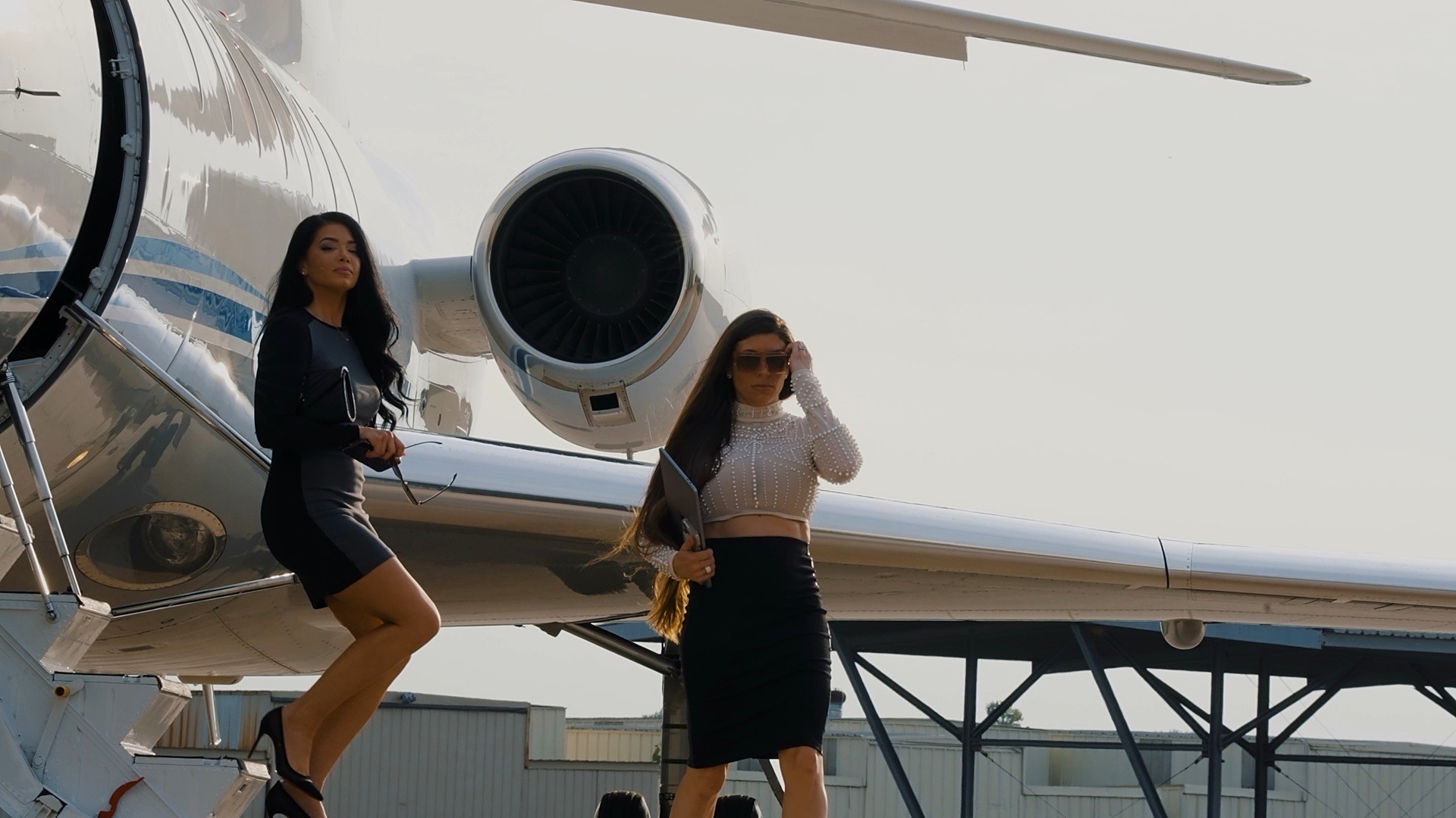 Guests stepping from a private jet on the Strategic ramp